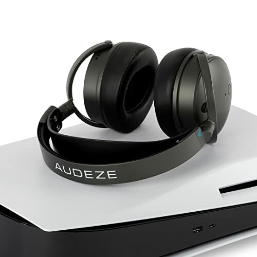 Audeze headphones resting on a gaming console.