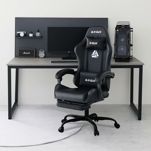 Gaming chair and desk setup with computer and accessories